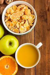 Image showing Healthy home made breakfast of muesli, apples, fresh fruits and walnuts