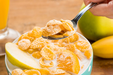 Image showing Healthy home made breakfast of muesli, apples, fresh fruits and walnuts