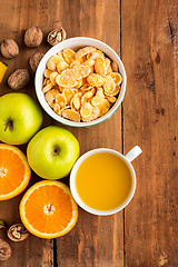 Image showing Healthy home made breakfast of muesli, apples, fresh fruits and walnuts