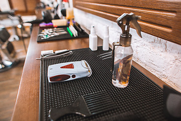 Image showing Barber shop equipment on wooden background.