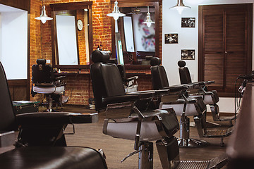 Image showing Vintage chairs in barbershop