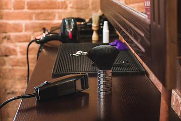 Image showing Barber shop equipment on wooden background.