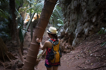 Image showing Brunette in hat with backpack