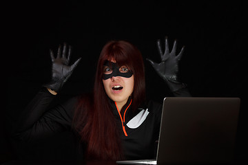 Image showing Woman spy with raised hands