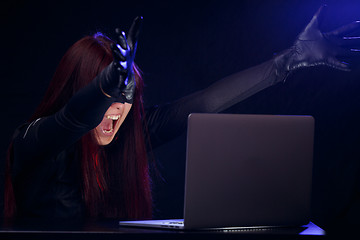 Image showing Woman near computer at night