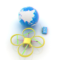 Image showing Quadrocopter Drone with Earth Globe and remote controller on a w