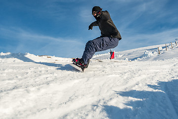 Image showing Snowboard freerider in the mountains