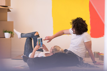 Image showing Happy young couple relaxing after painting