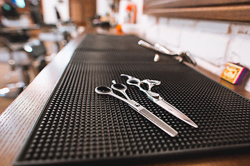 Image showing Barber shop equipment on wooden background.