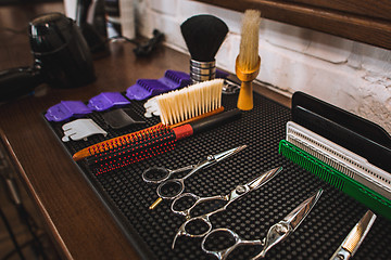 Image showing Barber shop equipment on wooden background.