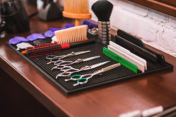 Image showing Barber shop equipment on wooden background.