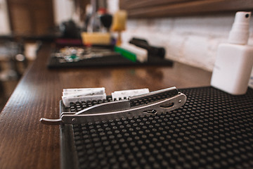 Image showing Barber shop equipment on wooden background.