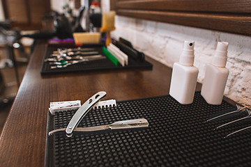 Image showing Barber shop equipment on wooden background.