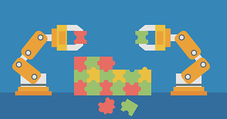 Image showing Two robotic arms building a colorful puzzle.