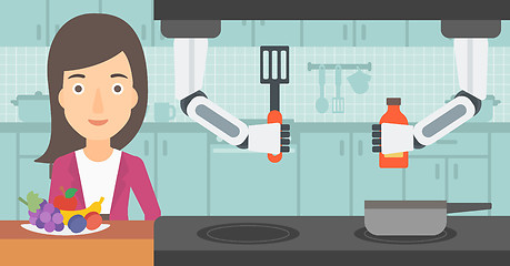 Image showing Domestic personal robot helps to owner at kitchen.