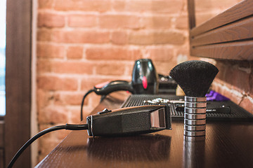 Image showing Barber shop equipment on wooden background.