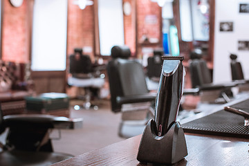 Image showing Barber shop equipment on wooden background.