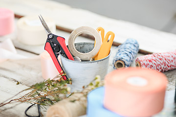 Image showing The florist desktop with working tools on white background