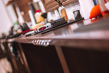 Image showing Barber shop equipment on wooden background.