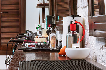 Image showing Barber shop equipment on wooden background.