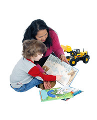 Image showing Little boy reading his books.