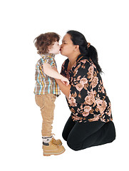 Image showing Nanny kisses her little boy.