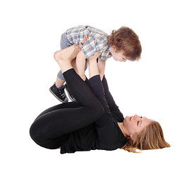 Image showing Mother and son playing on floor.