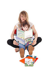 Image showing Mother and little boy reading.