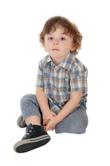 Image showing Little three year boy sitting on floor.