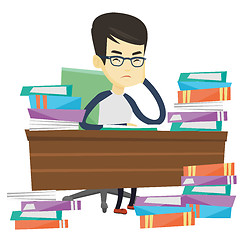 Image showing Student sitting at the table with piles of books.