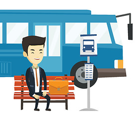 Image showing Business man waiting at the bus stop.