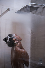 Image showing African American woman in the shower