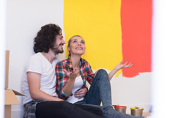 Image showing Happy young couple relaxing after painting