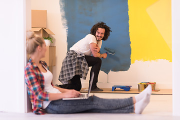 Image showing Happy couple doing home renovations