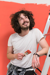 Image showing man with funny hair over color background with brush