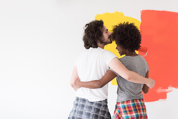 Image showing multiethnic couple painting interior wall