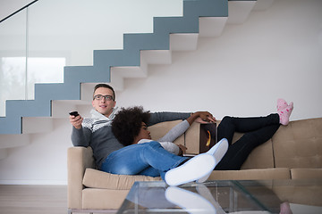 Image showing multiethnic couple relaxing at home