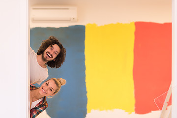 Image showing portrait of a couple painting interior wall