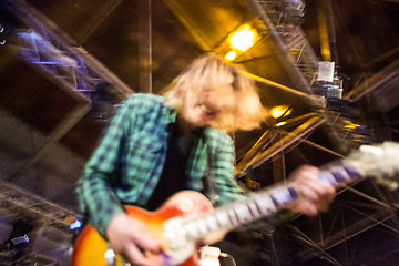 Image showing The blur silhouette of rock musician at abstract rock concert