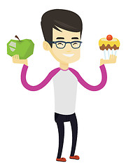 Image showing Man choosing between apple and cupcake.