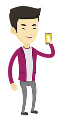 Image showing Man holding ringing mobile phone.