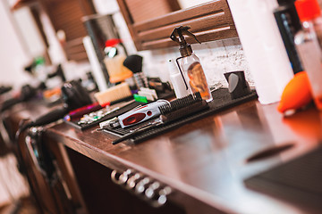 Image showing Barber shop equipment on wooden background.