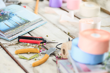 Image showing The florist desktop with working tools on white background