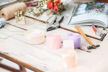 Image showing The florist desktop with working tools on white background