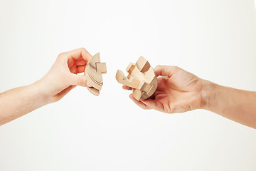 Image showing puzzle in hand isolated on white background