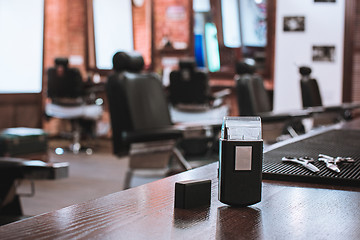 Image showing Barber shop equipment on wooden background.