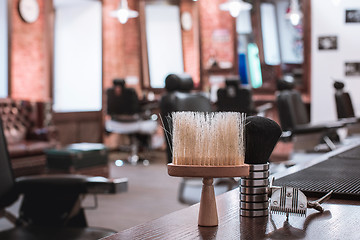 Image showing Barber shop equipment on wooden background.