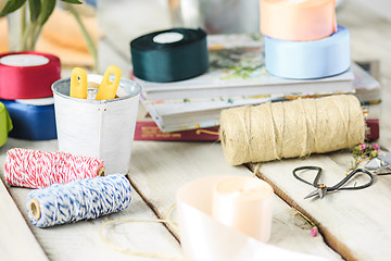 Image showing The florist desktop with working tools on white background