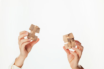 Image showing puzzle in hand isolated on white background