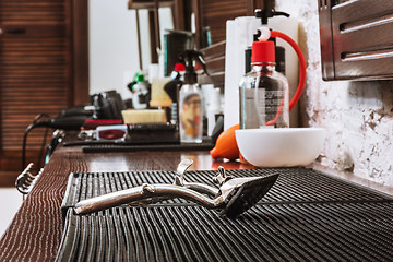 Image showing Barber shop equipment on wooden background.